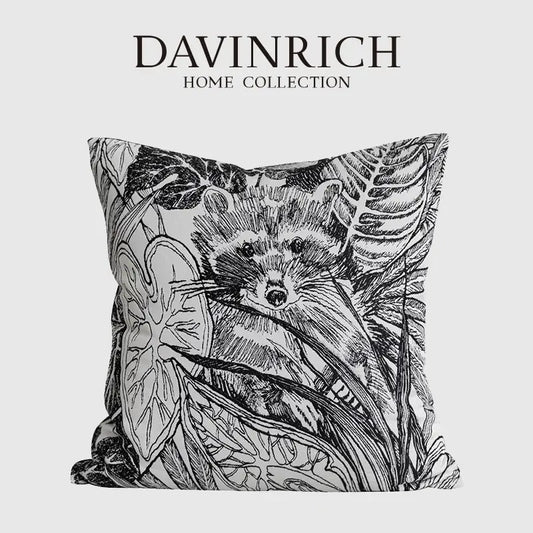 Black and white illustrated raccoon pillow cover with detailed botanical leaves from davinrich home decorbites jungle plant collection