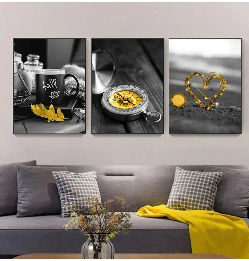 Set of three black and white nordic landscape canvas panels featuring coffee mug compass and heart light designs by decorbites