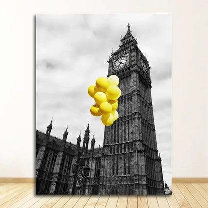 A vibrant cluster of yellow balloons floats in front of the black and white nordic landscape canvas set featuring big ben