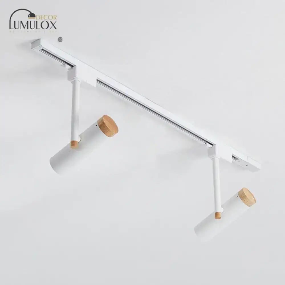 Modern white DecorBites™ Nordic tubular metallic spotlight with wooden cap featuring sleek metal track lighting components