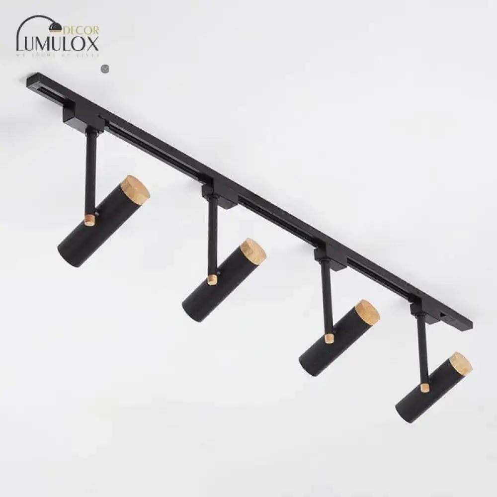 Black cylindrical track lighting fixtures with natural wood caps by lumulox from decorbites™ nordic tubular spotlight series