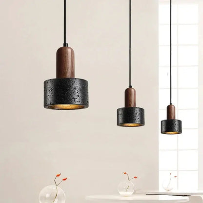 Black and wood concrete pendant light with textured finish and dark wood accents for bedroom decorbites cream nordic decor