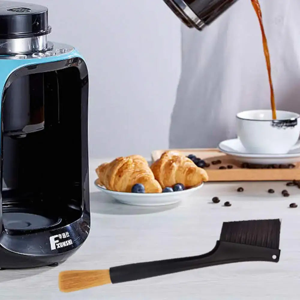 Black and teal espresso machine cleaner brush with silver accents by decorbites for efficient espresso machine cleaning