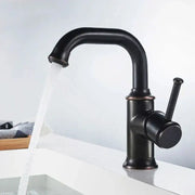 Black antique brass basin faucet with matte black finish and copper accents for kitchen mixer by decorbites