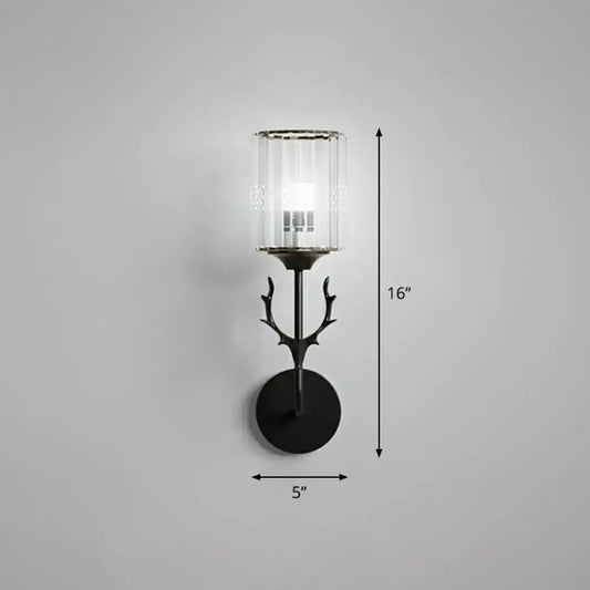 Black metal antler-inspired wall sconce with clear cylindrical glass shade compatible with e26 e27 bulbs for bedroom use