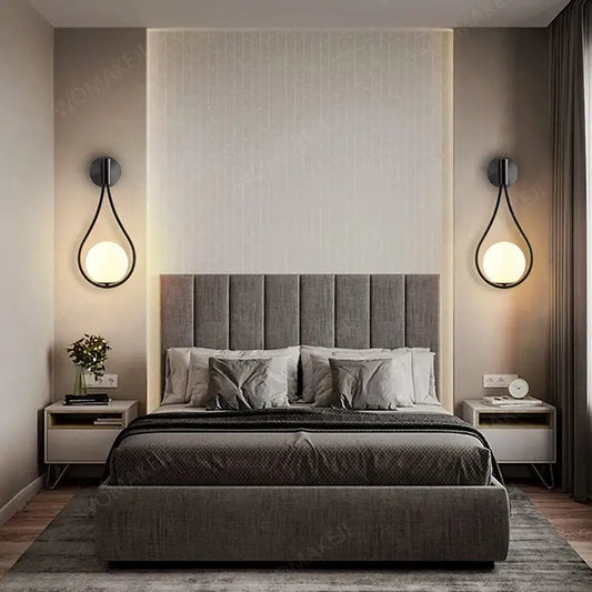 Gray upholstered bed shown alongside decorbites™ black battery operated wall sconces with remote and usb type-c charging