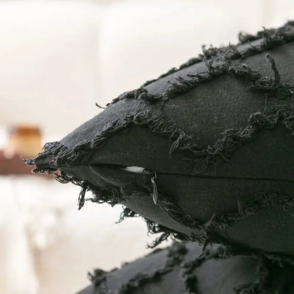 Dark gray distressed fabric pillow cover with frayed edges and visible zipper decorbites black boho lumbar decor