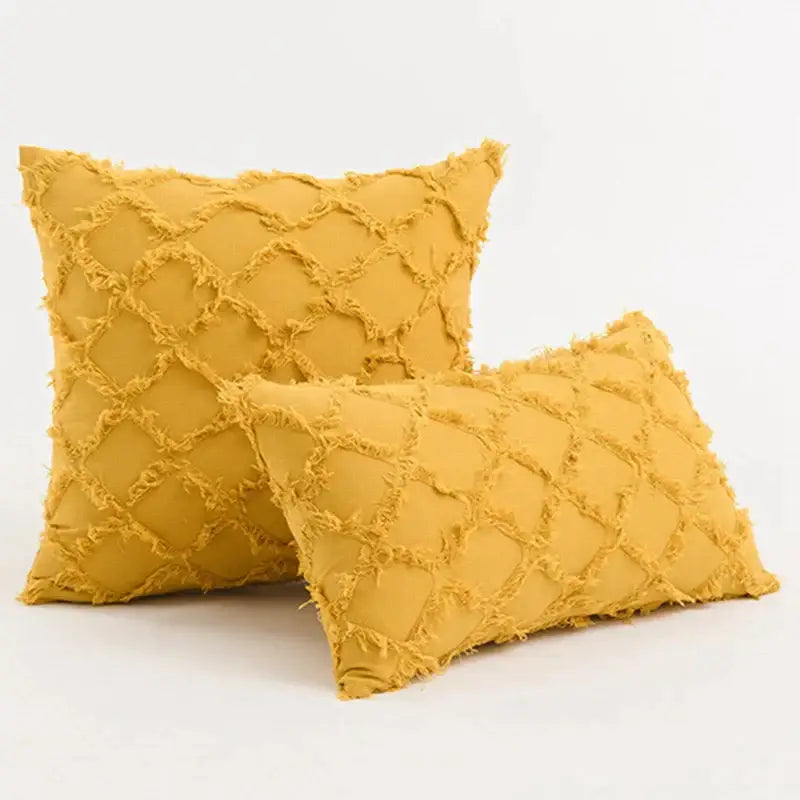 Yellow textured throw pillows with diamond pattern and frayed edges complement decorbites black boho lumbar pillow cover