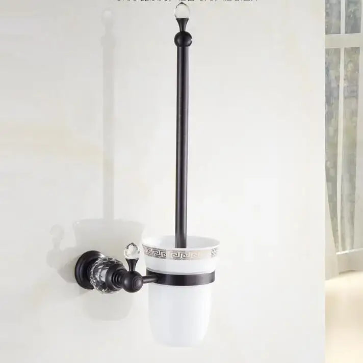 Black brass bathroom accessories set with black metal toilet brush holder and white ceramic cup with greek key pattern and crystal accents