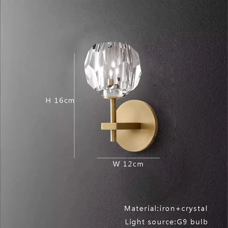 A modern wall sconce with faceted crystal globe and brass-finished iron base for decorbites black bronze copper chandelier lights