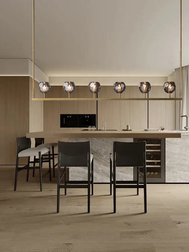 Modern minimalist chandelier lights with faceted glass shades and black bronze copper frames for kitchen island decorbites