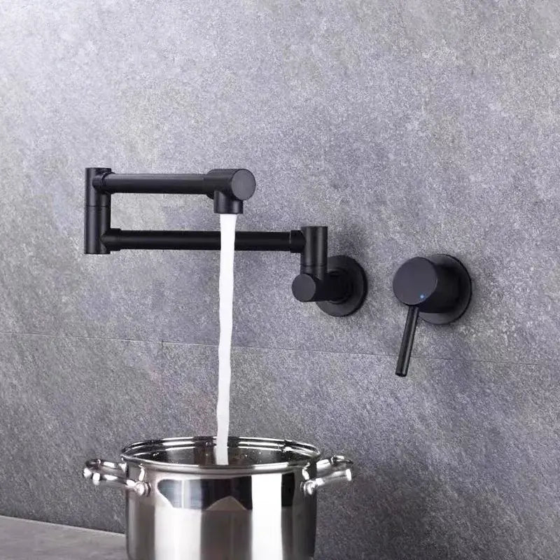 Black matte finish wall-mounted kitchen pot filler faucet with articulated arm and dual handles by decorbites black brushed gold