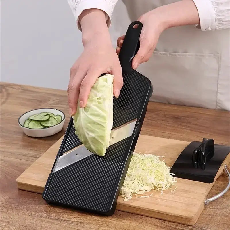 Black plastic and stainless steel decorbites cabbage grater with ridged surface for shredding cabbage finely