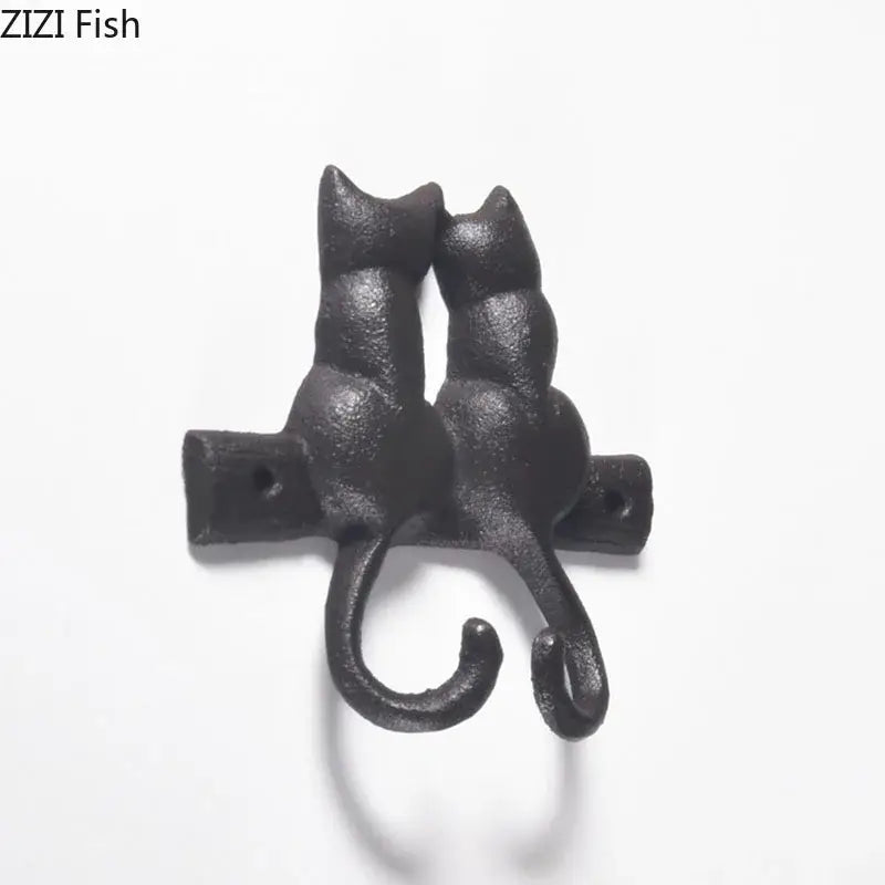 Black cast iron cat hook shaped like two cats back to back for hanging shelf outdoor wall decorbites cat hook decor