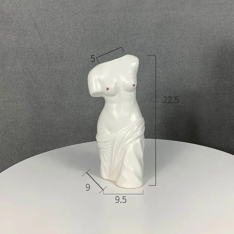 White ceramic human body figurine bust with draped fabric and decorative studs for decorbites living room decor