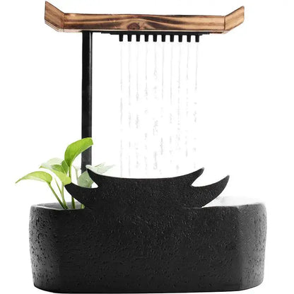 Black ceramic water fountain with wooden roof and small green plant decorbites ceramic water fountain for living room decor