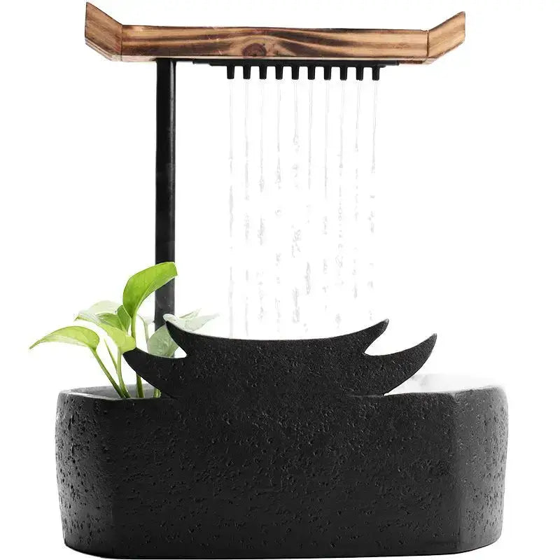 Black ceramic water fountain with wooden roof and small green plant decorbites ceramic water fountain for living room decor