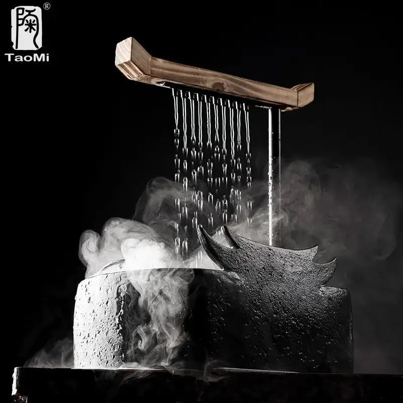 Black ceramic water fountain with rustic wooden lid and textured gray ceramic body by taomi for decorbites ceramic water fountain decor