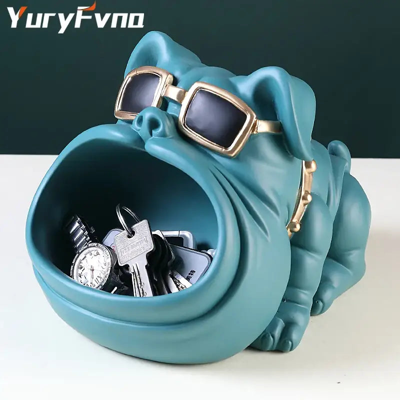 Teal ceramic cool dog sculpture with gold-rimmed sunglasses and collar serving as a key holder and coin bank decorbites