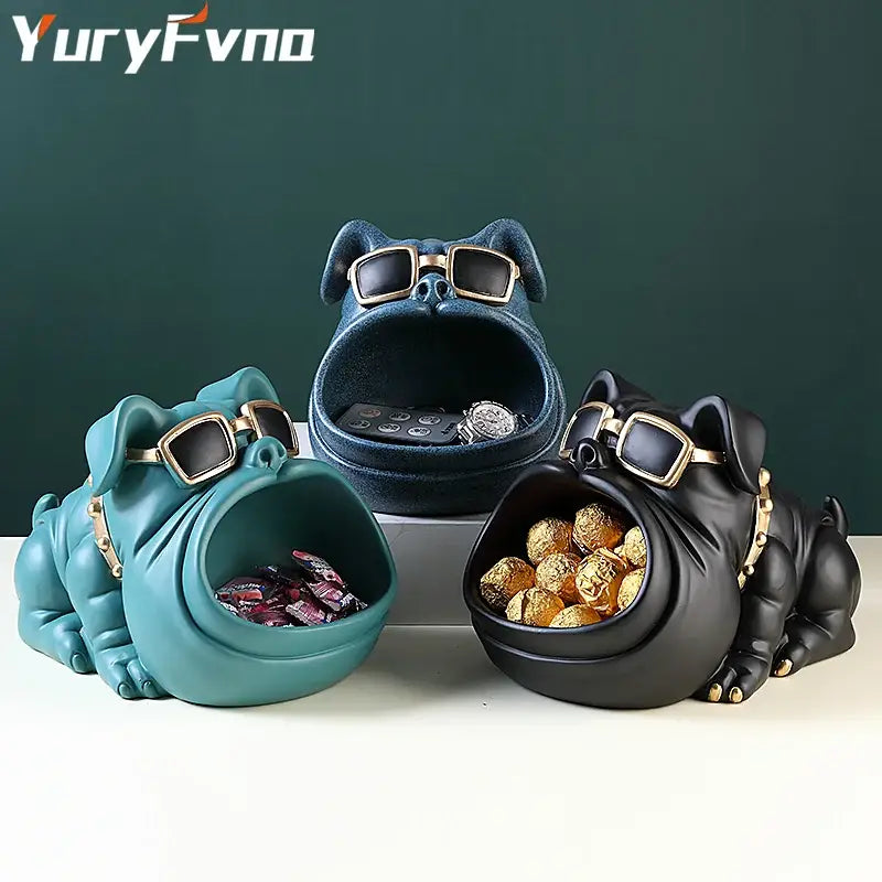 Three stylized bulldog cool dog sculptures in teal navy blue and black with gold rimmed sunglasses for decorbites cool dog table decor