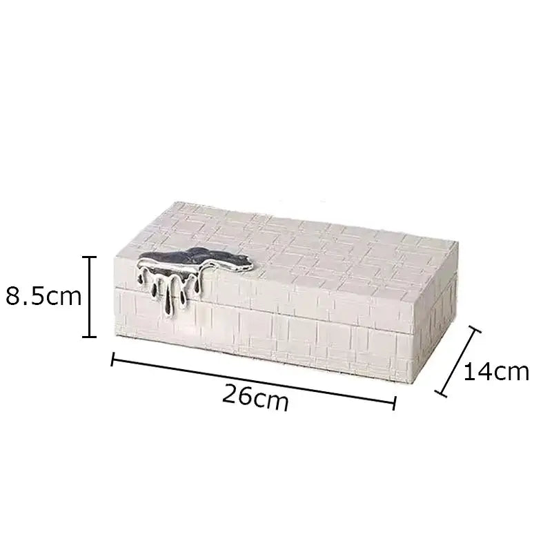 White brick-textured rectangular jewelry box with silver drip clasp for black crocodile leather jewelry storage