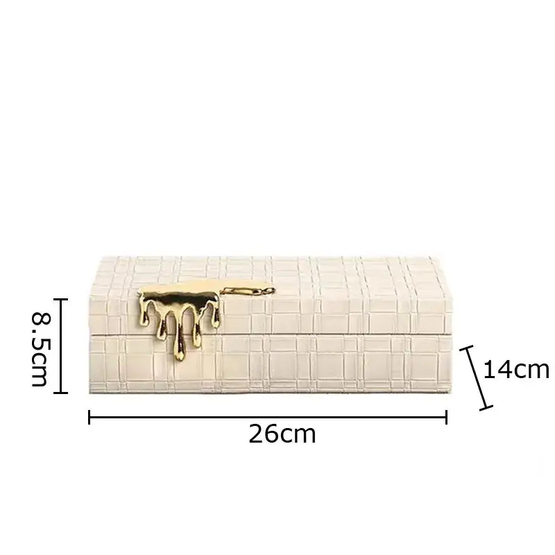 Cream-colored leather jewelry box with textured crocodile skin pattern and gold-tone dripping handle for bedroom storage