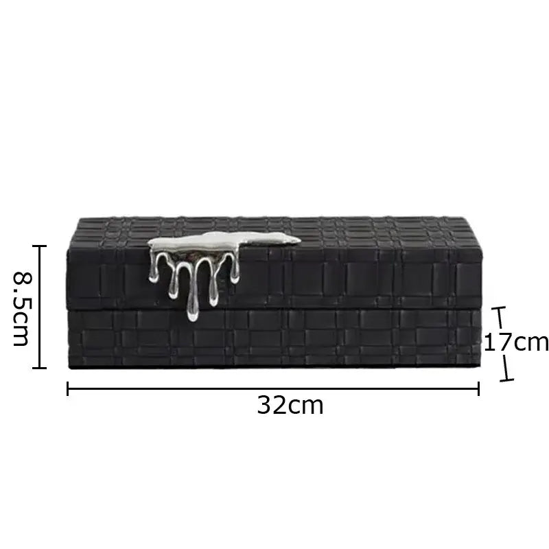 Black crocodile leather jewelry box with woven texture and silver drip clasp for elegant jewelry storage
