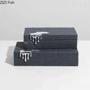 Black crocodile leather jewelry box with textured pattern and silver metallic drips designed by zizi fish