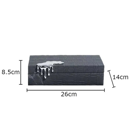 Black crocodile leather jewelry box with textured pattern and silver metallic drip lid for bedroom storage
