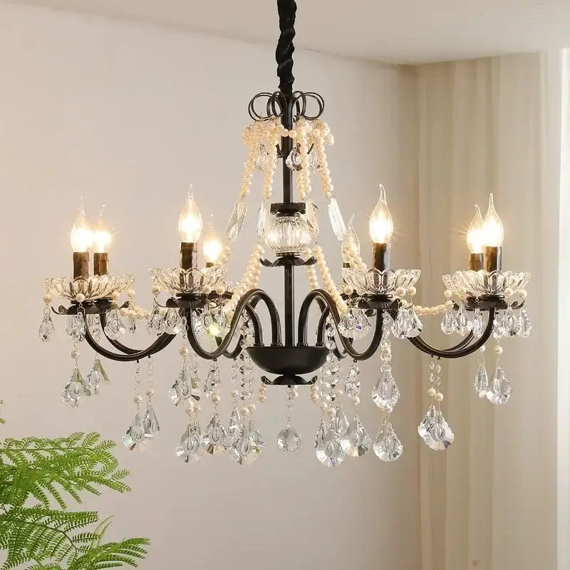 Black crystal chandelier with pearls featuring black wrought iron and clear crystal droplets by decorbites black crystal