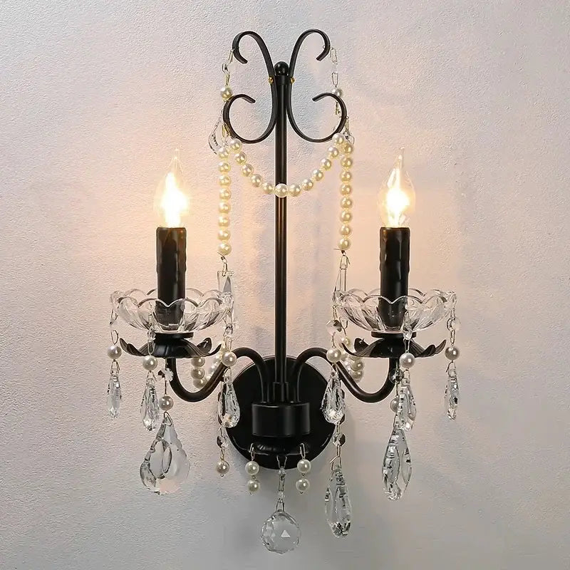 Black wrought iron decorbites black crystal chandelier with two candle bulbs, crystal teardrops, and pearl strands foyer pendant light