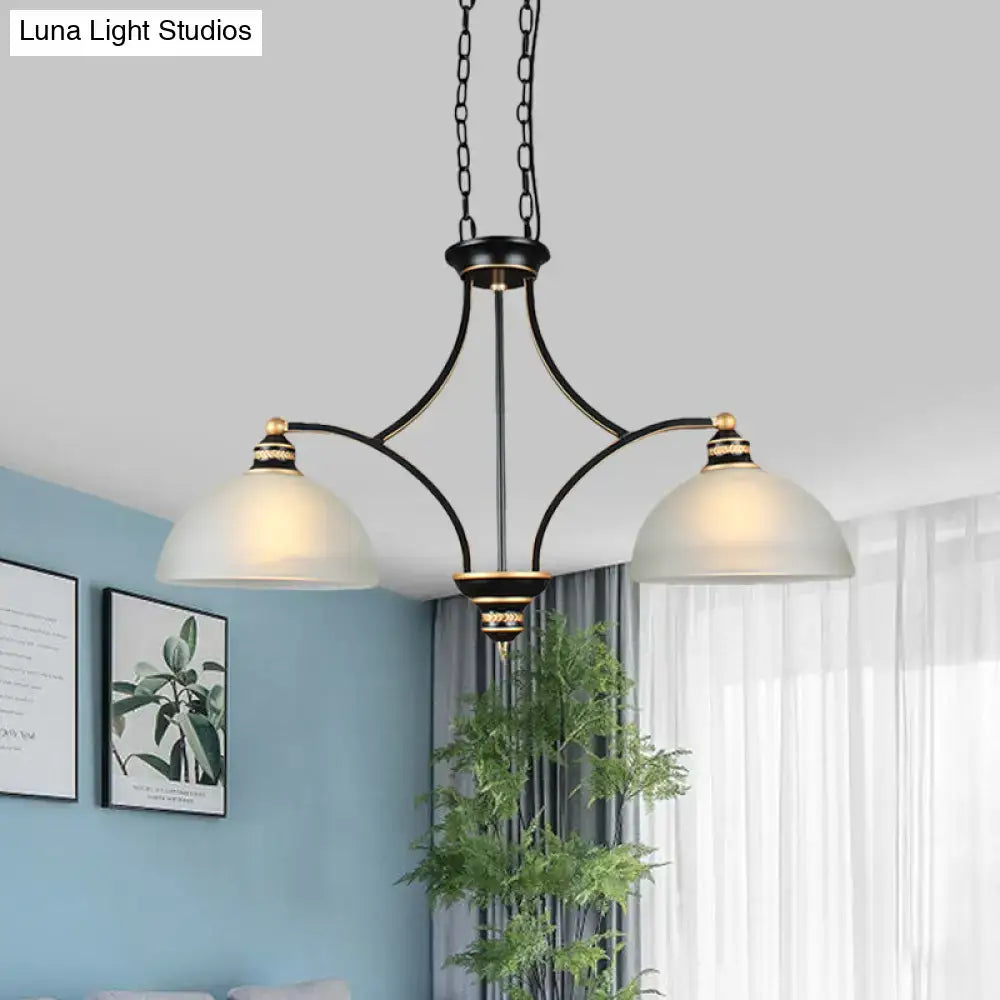 Black wrought iron traditional black dome chandelier with two white glass shades and gold-toned accents for dining room