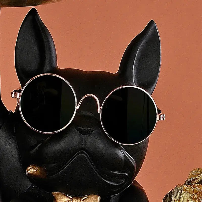 Black french bulldog butler decor tray featuring a figurine with round silver-framed sunglasses for living room display