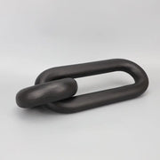 Black geometric resin ornament chain link sculpture in black matte finish for living room decor by decorbites