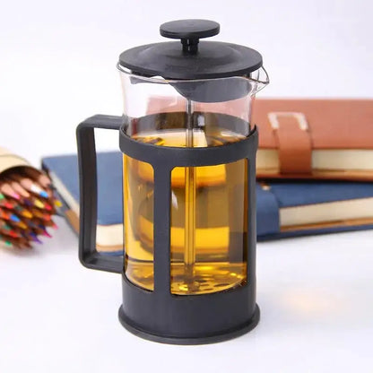 Black-framed glass 350ml french press filled with golden-brown brewed tea for kitchen coffee and tea making