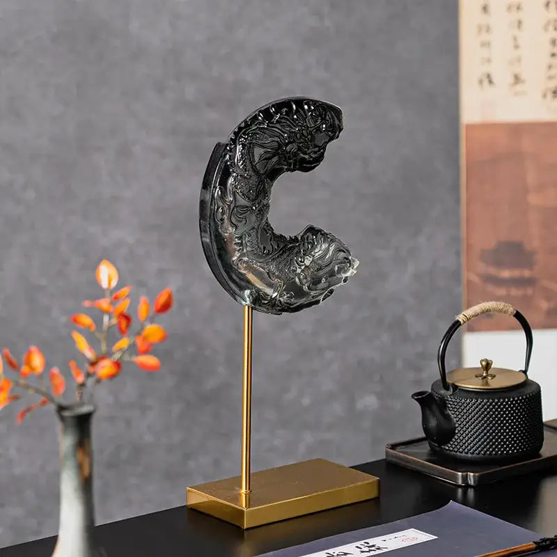 Black translucent gradient jade dragon and fish carving in elegant c-shape on gold stand for decorbites crescent moon decor