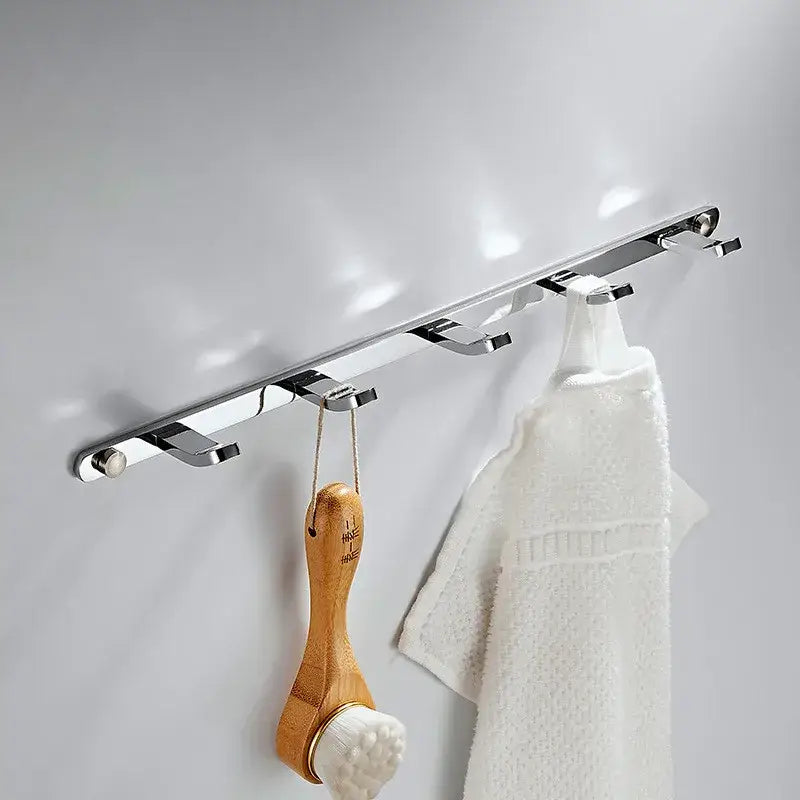 Chrome finished wall-mounted robe rack with five sleek hooks featuring decorbites brass black gold accents for bathroom storage