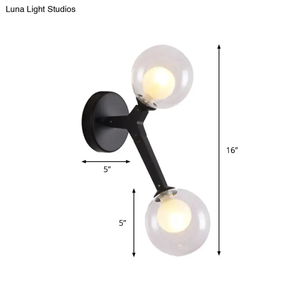 Black metal bubble wall sconce with two clear glass globe shades for bedroom lighting decor