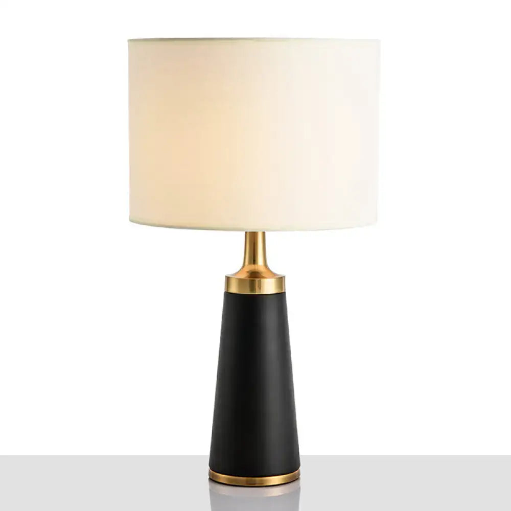 Decorbites™ drum bedside lamp with black conical base, gold accents, and cream fabric shade for 220v-240v use