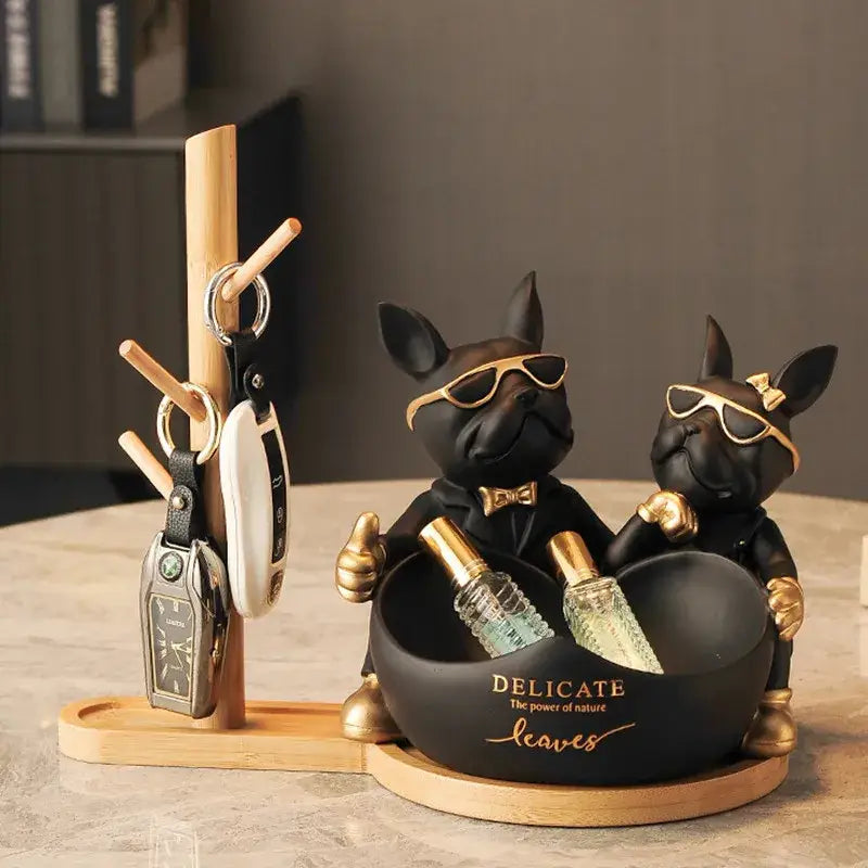 Black and gold french bulldog butler statue with sunglasses and bow ties designed as a sleek office desk organizer