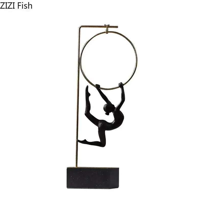 Black and gold gymnastic acrobat resin sculpture featuring a black figurine on gold-toned poles mounted on a sleek base