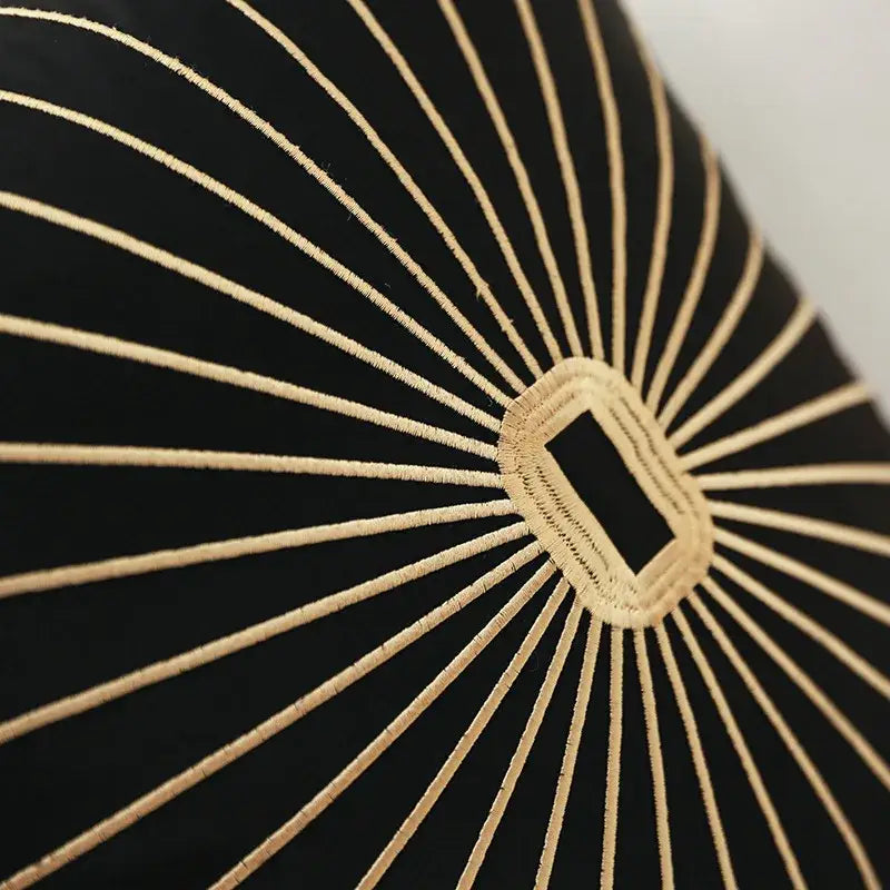Black and gold embroidery pillow covers with intricate sunburst thread design on black cushion for living room decor