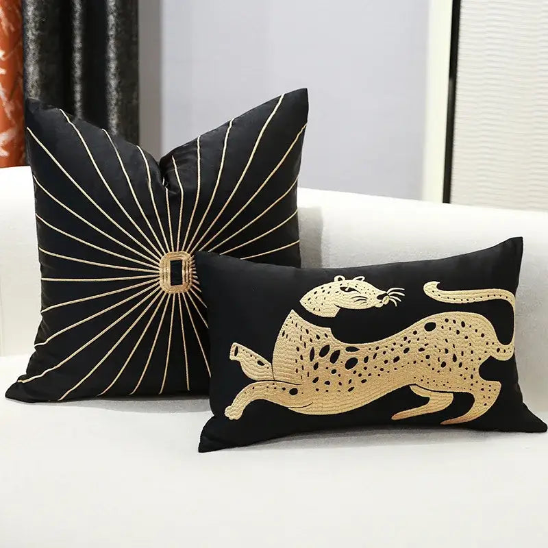 Black and gold embroidery pillow covers featuring a leaping leopard and sunburst design for living room decor