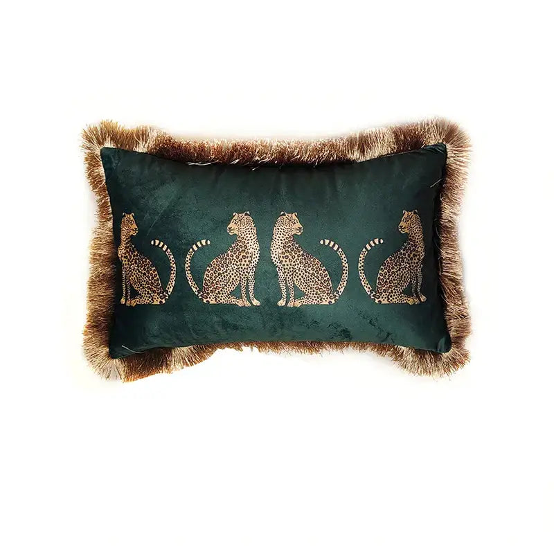 Deep green velvet throw pillow cover with embroidered gold leopard silhouettes and brown faux fur tassels for living room