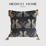 Black velvet throw pillow cover with gold leopard print and tassels at each corner for living room decor