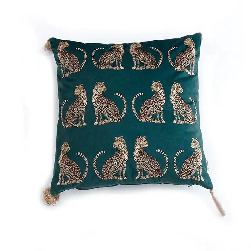 Deep teal velvet throw pillow cover with embroidered black and gold leopard motifs and tassels for living room decor