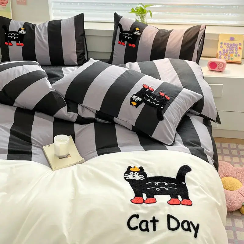 Black and gray bedding set with cat embroidery stripes featuring embroidered black cats and a cat day patch on duvet cover