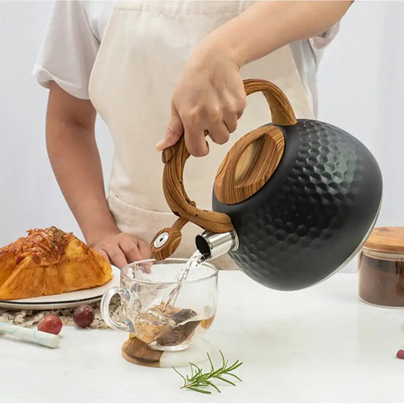 Black hammered stainless steel whistle boiling kettle with wooden handle and lid ideal for kitchen decor
