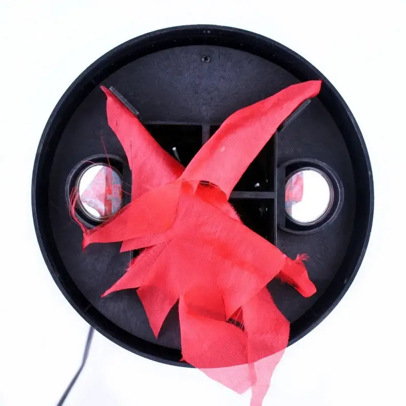 A vibrant red sheer fabric star-shaped electronic brazier flame lamp pendant light with black circular base and mirrors