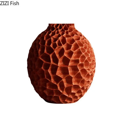 A terracotta ceramic vase with honeycomb texture ideal for artificial flower arrangement in living room decor